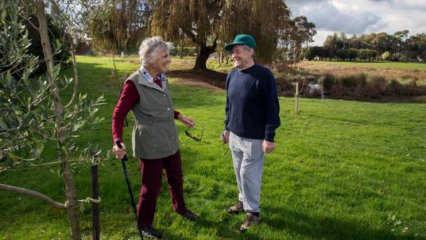 Members of Timona Park Orchard Trust looking at the young trees